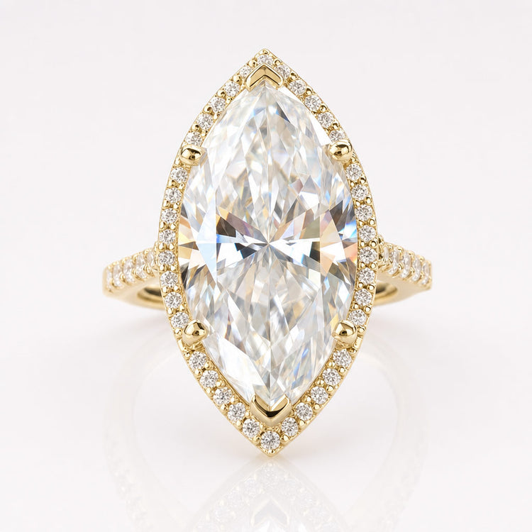 Marquise cut moissanite halo ring framed by pave set stones