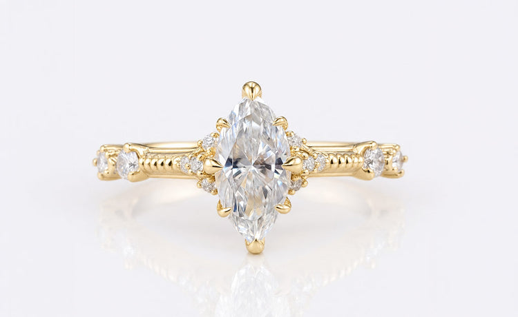 Marquise cut moissanite engagement ring with an elongated pointed centre stone