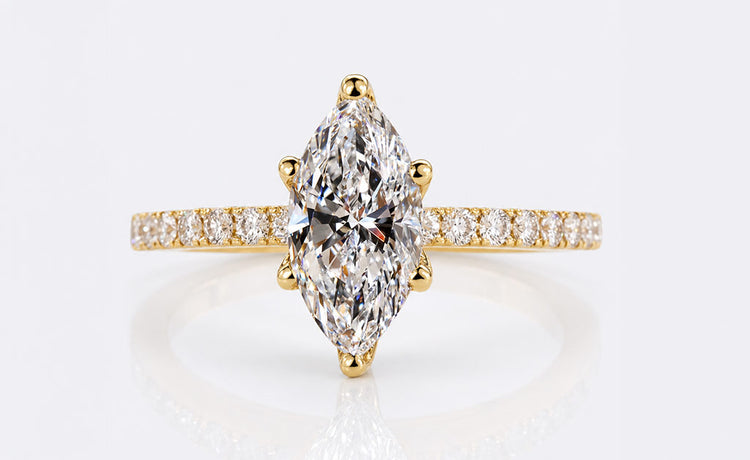 Marquise cut lab grown diamond ring with a pave set diamond band