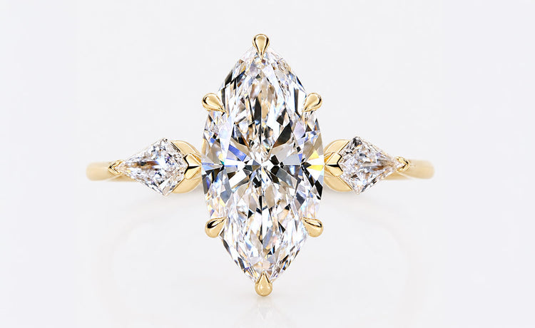 Marquise cut lab grown diamond three stone ring with two side stones