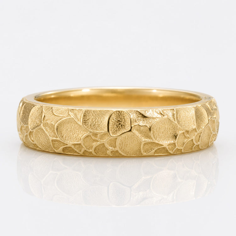 Men's moissanite wedding band in solid gold with a comfort fit profile