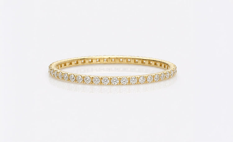 Moissanite tennis bracelet with round brilliant cut stones in solid gold
