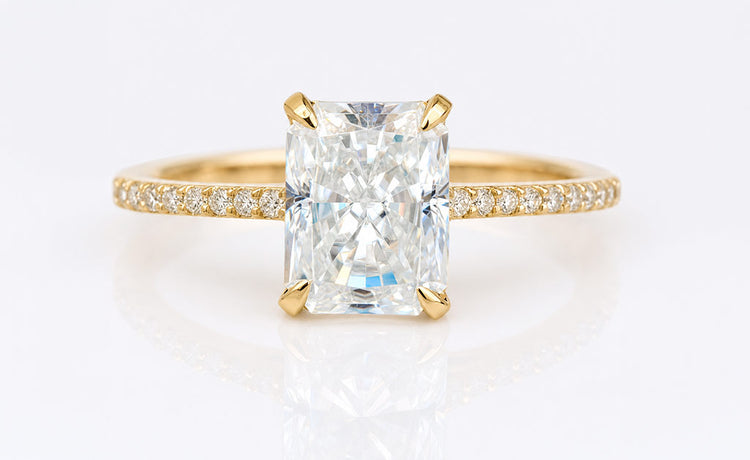 Moissanite bridal set with a matching engagement ring and wedding band in solid gold