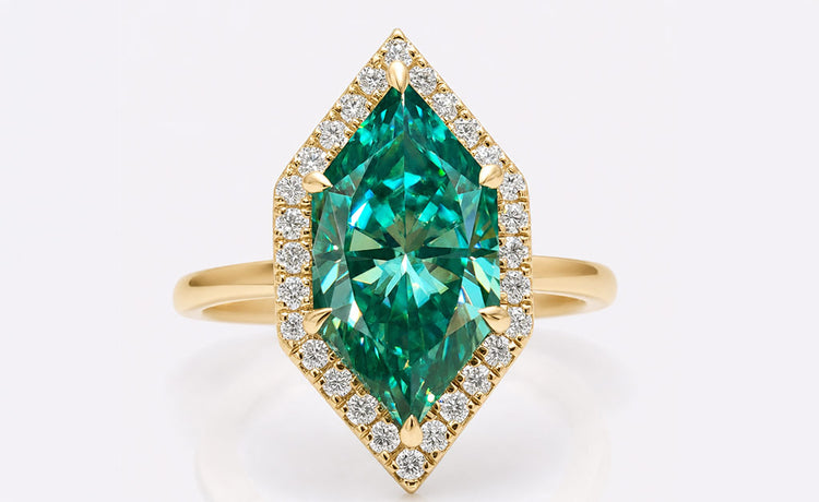 Fancy coloured moissanite engagement ring with a vivid centre stone in a gold setting