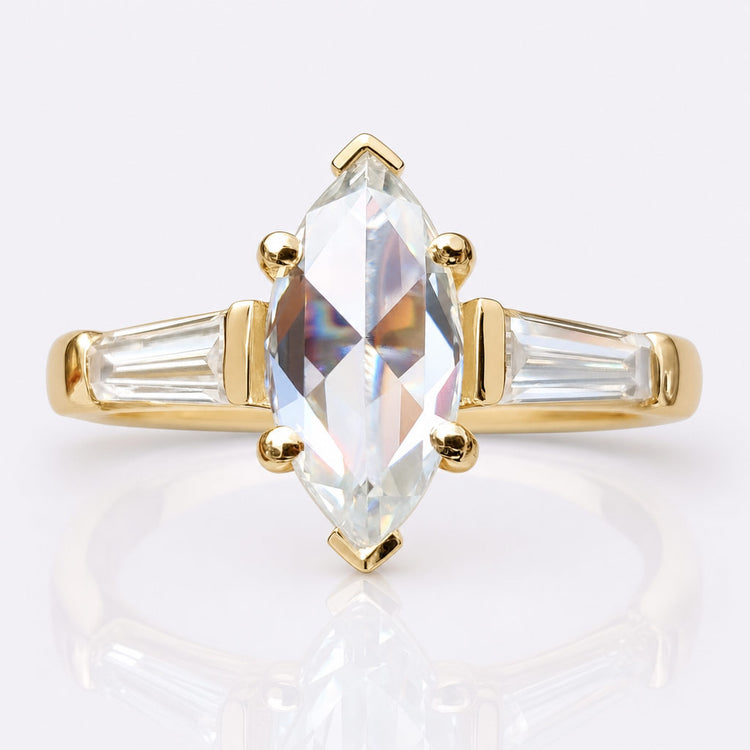 Moissanite three stone engagement ring with a centre stone flanked by two side stones