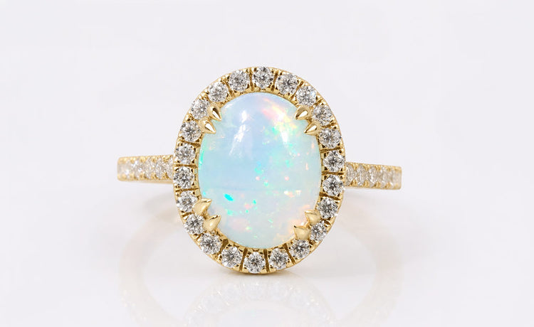 Natural opal ring, the birthstone for October, in a solid gold setting