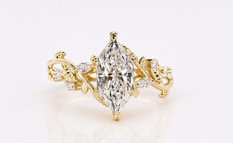 Nature inspired ring with leaf and vine detailing in solid gold