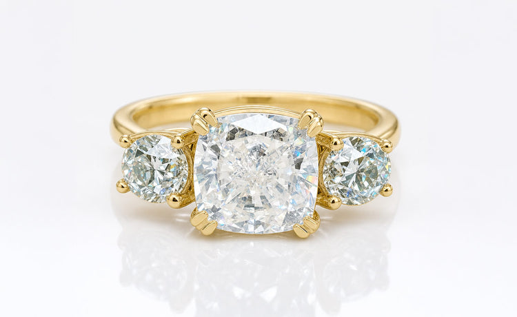 Old European cut coloured moissanite ring with a tinted centre stone