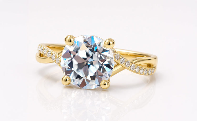 Old European cut moissanite ring with a pave set band in solid gold