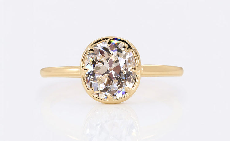 Old European cut lab grown diamond solitaire ring on a plain solid gold band