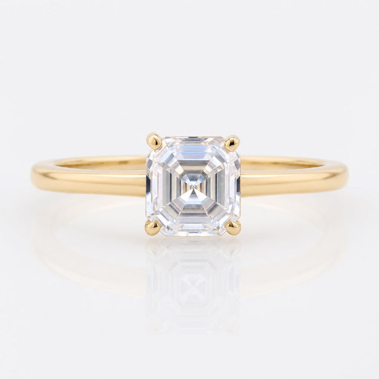 Off white moissanite stone with a warm tinted body colour