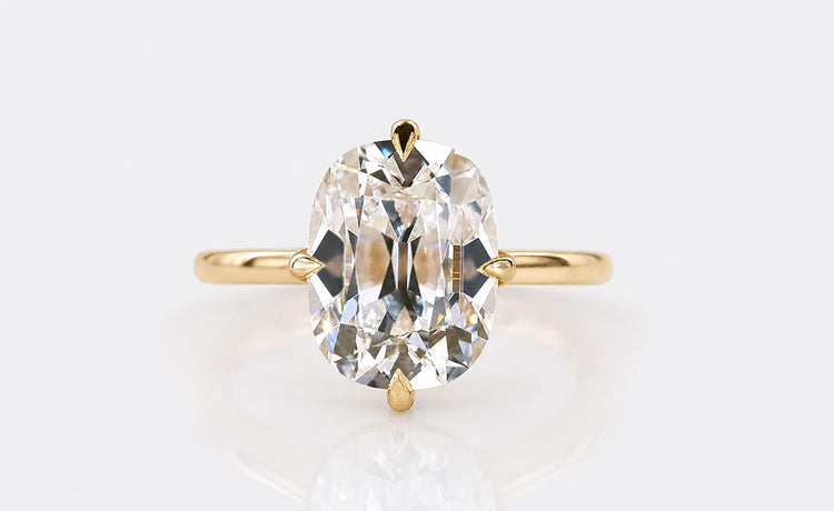 Old mine cut lab grown diamond ring with a cushion outline and antique faceting