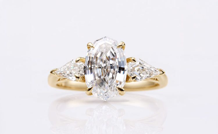 Antique style oval cut moissanite ring with milgrain detailing in solid gold