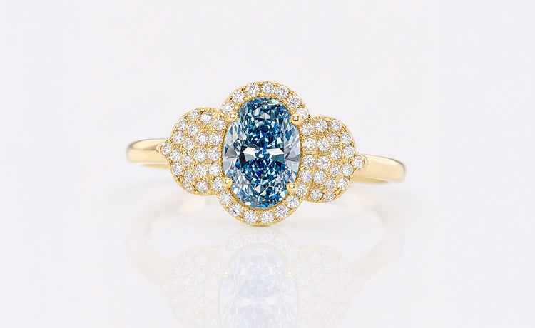 Oval cut coloured lab grown diamond ring with a tinted centre stone