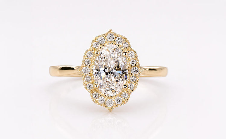 Oval cut lab grown diamond halo ring framed by pave set diamonds