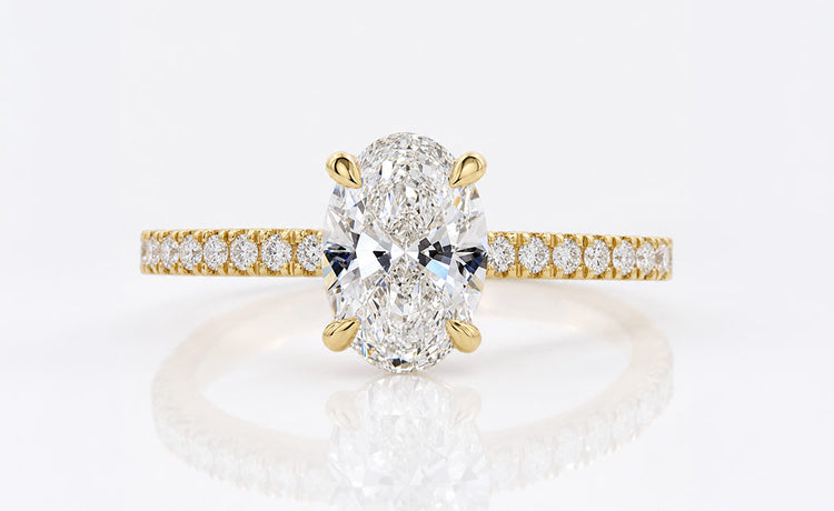 Oval cut lab grown diamond ring with a pave set diamond band