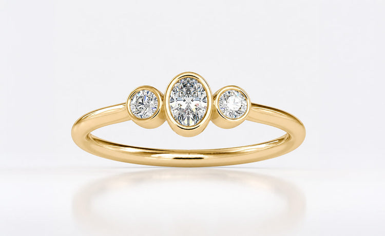 Oval cut moissanite engagement ring with an elongated centre stone in gold