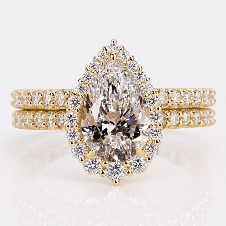 Pear cut lab grown diamond bridal set with a matching engagement ring and band