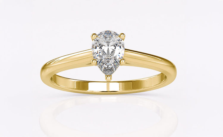 Pear cut moissanite rings, pendants and earrings in solid gold settings