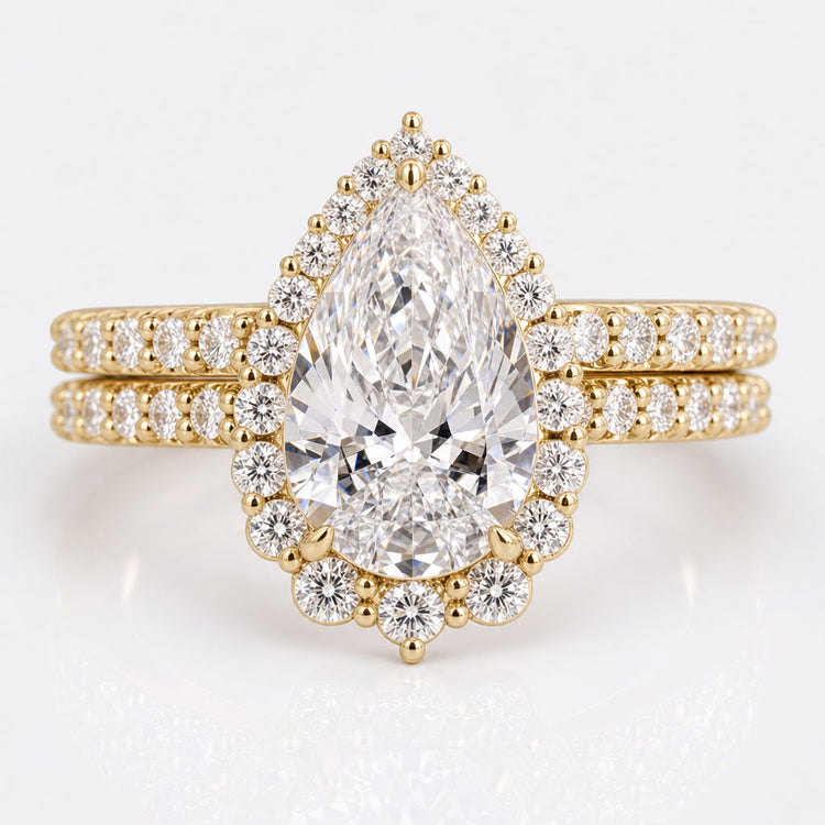 Pear cut lab grown diamond ring with a pave set diamond band
