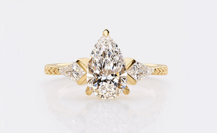 Vintage style pear cut lab grown diamond ring with milgrain detailing
