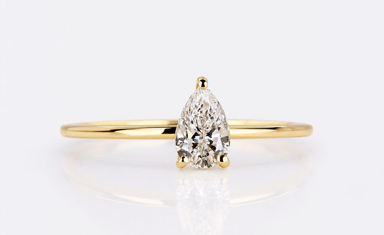 Pear cut engagement ring with a teardrop centre stone in solid gold