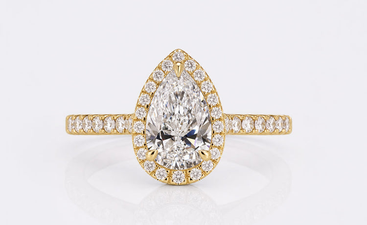 Pear shaped lab grown diamond engagement ring in a solid gold setting