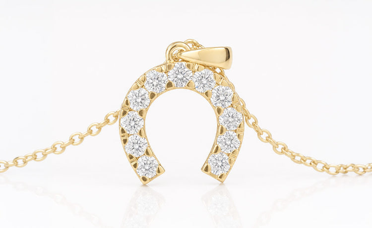 Moissanite and lab grown diamond pendants on fine gold chains
