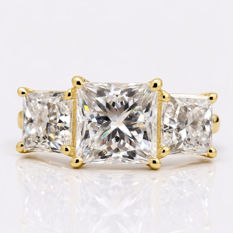 Princess cut diamond ring with a square centre stone in a solid gold setting