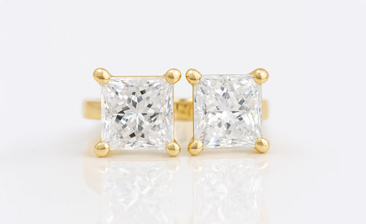 Princess cut moissanite stud earrings in solid gold settings