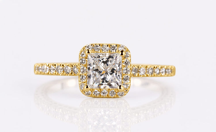 Princess cut lab grown diamond halo ring framed by pave set diamonds
