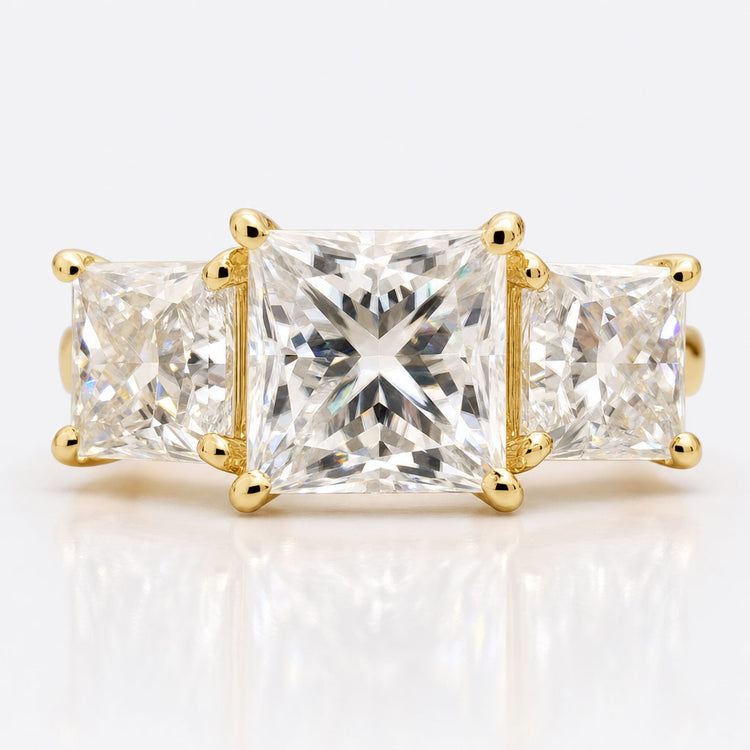 Princess cut moissanite rings, earrings and pendants in solid gold
