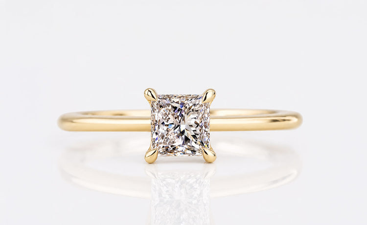 Princess cut lab grown diamond solitaire ring on a plain solid gold band
