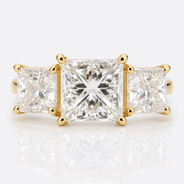 Princess cut moissanite three stone ring with a centre stone and two side stones