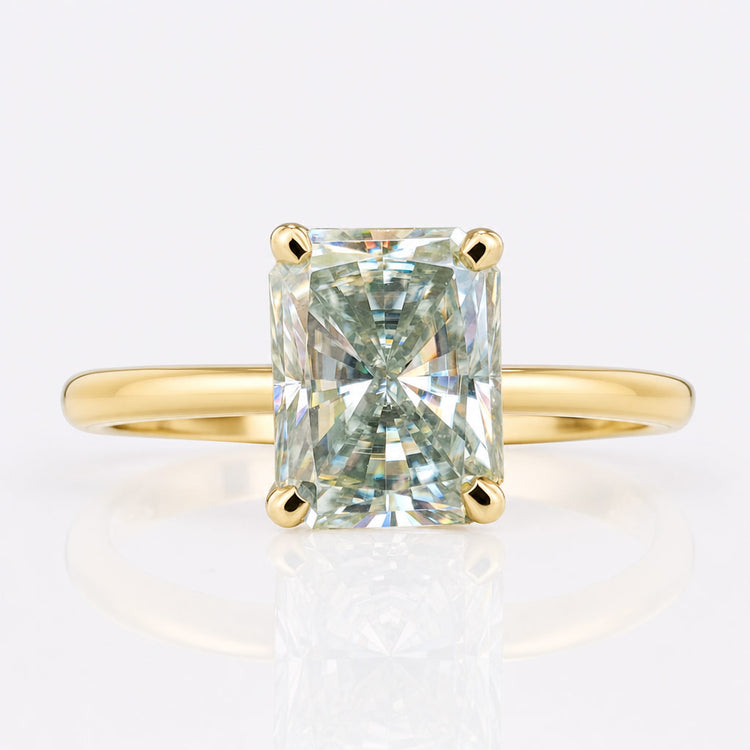 Radiant cut coloured moissanite ring with a tinted centre stone in solid gold