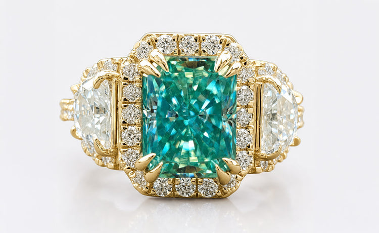 Radiant cut moissanite halo ring framed by pave set stones