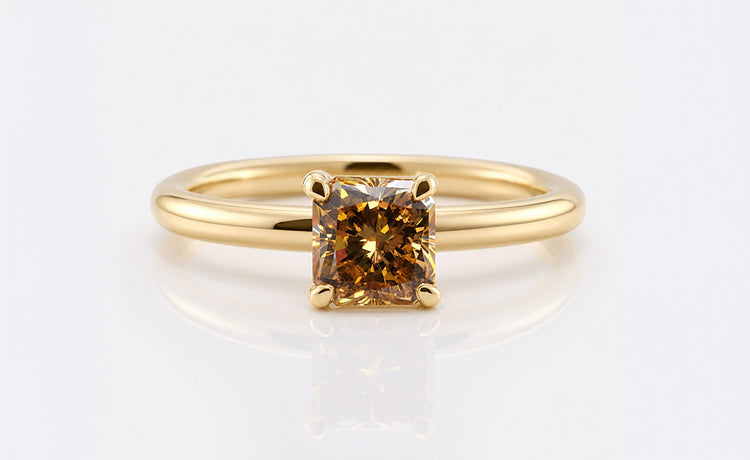 Radiant cut moissanite engagement ring with an elongated centre stone in gold