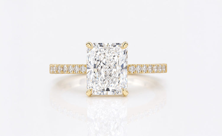 Radiant cut lab grown diamond ring with a pave set diamond band
