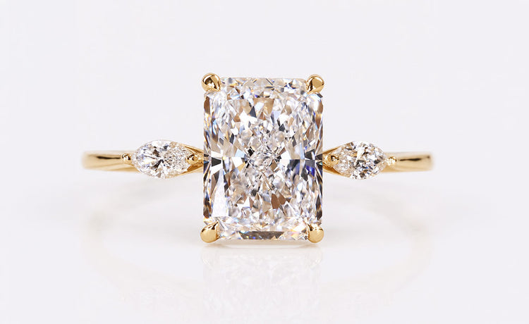 Radiant cut lab grown diamond three stone ring with two side stones