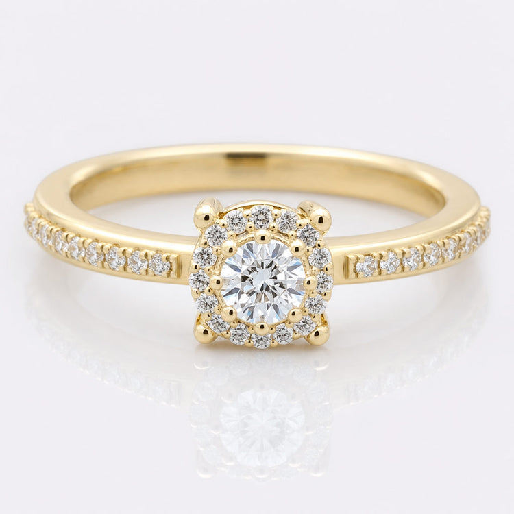Round cut moissanite ring with a pave set band in solid gold