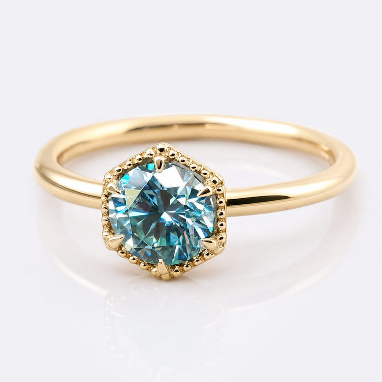 Round cut moissanite solitaire ring on a plain solid gold band