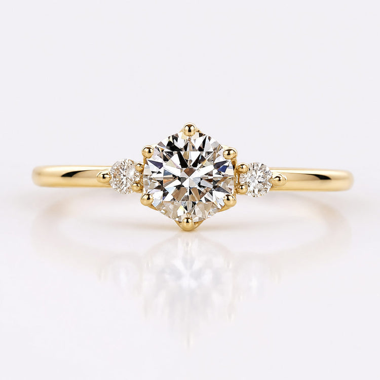 Round cut lab grown diamond three stone ring with two side stones
