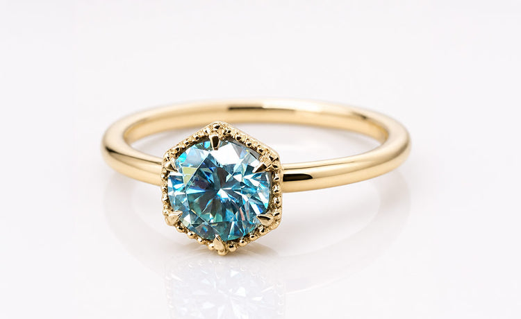 Round cut engagement ring with a brilliant centre stone in a solid gold setting