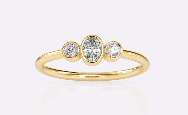 Three stone engagement ring with a centre stone flanked by two side stones