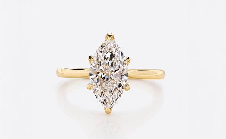 Tulip prong engagement ring with sculpted petal style claws in solid gold