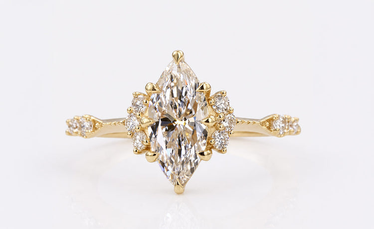 Vintage engagement ring with milgrain detailing and an ornate gold setting