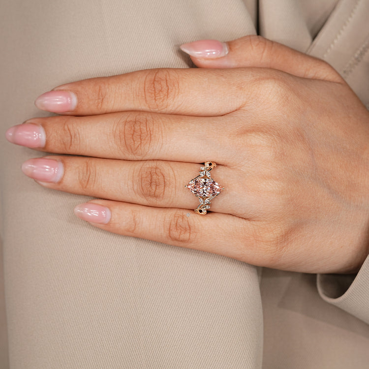 Marquise diamond ring with nature inspired leaf details.