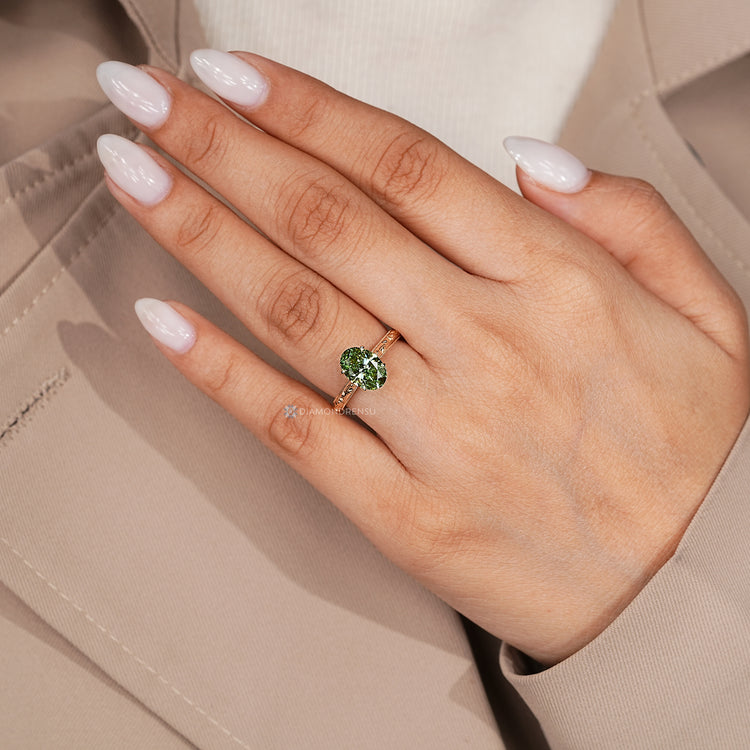 Nature inspired oval diamond ring with bridge accent.