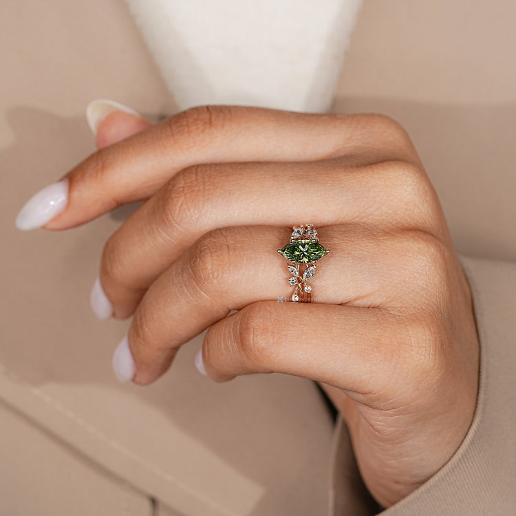 Lab grown marquise diamond ring with cluster setting.