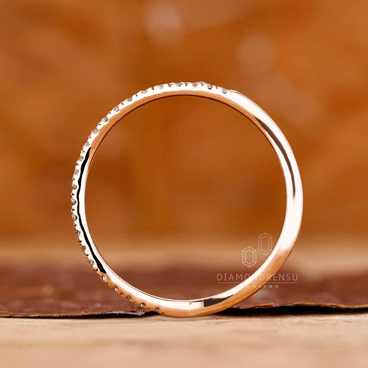 Lab grown round diamond band ocean wave style.
